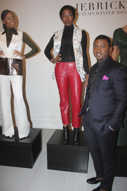 Designer Jerrick Gray poses in front of a model wearing his designs at his showcase on Feb. 11 in New York City. Photo by Chinks Doe Photography.